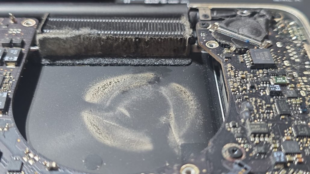 Internal view of a MacBook Pro A2141 during a thermal paste replacement and deep cleaning service.