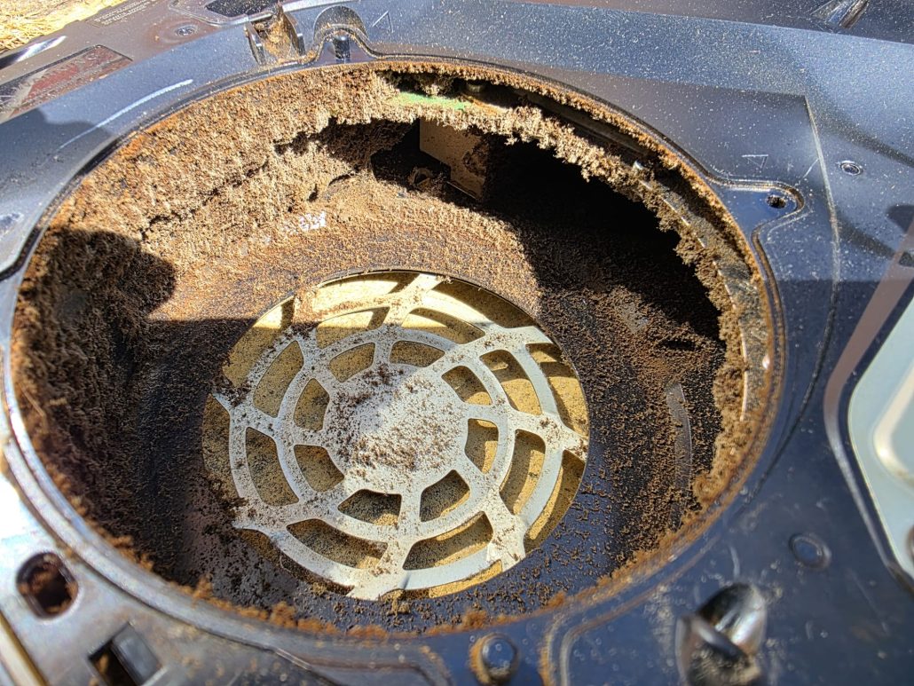 PS5 fan housing packed with compacted dust and debris