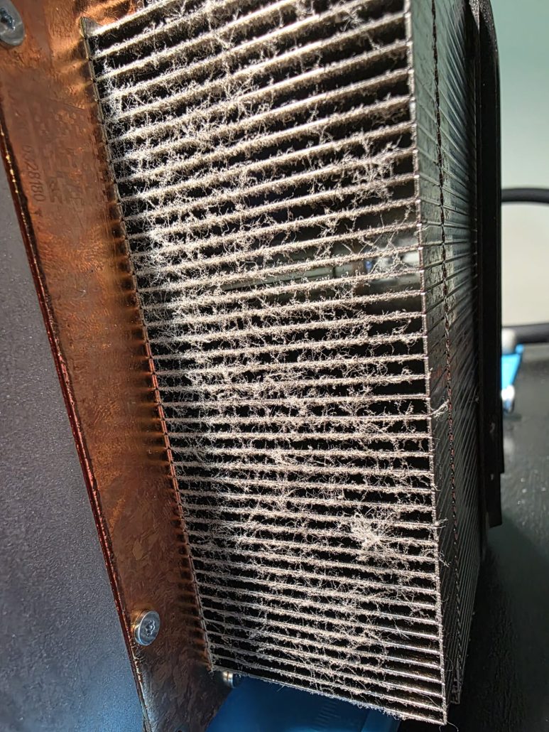 Xbox heatsink fins packed with dust and fibres blocking airflow