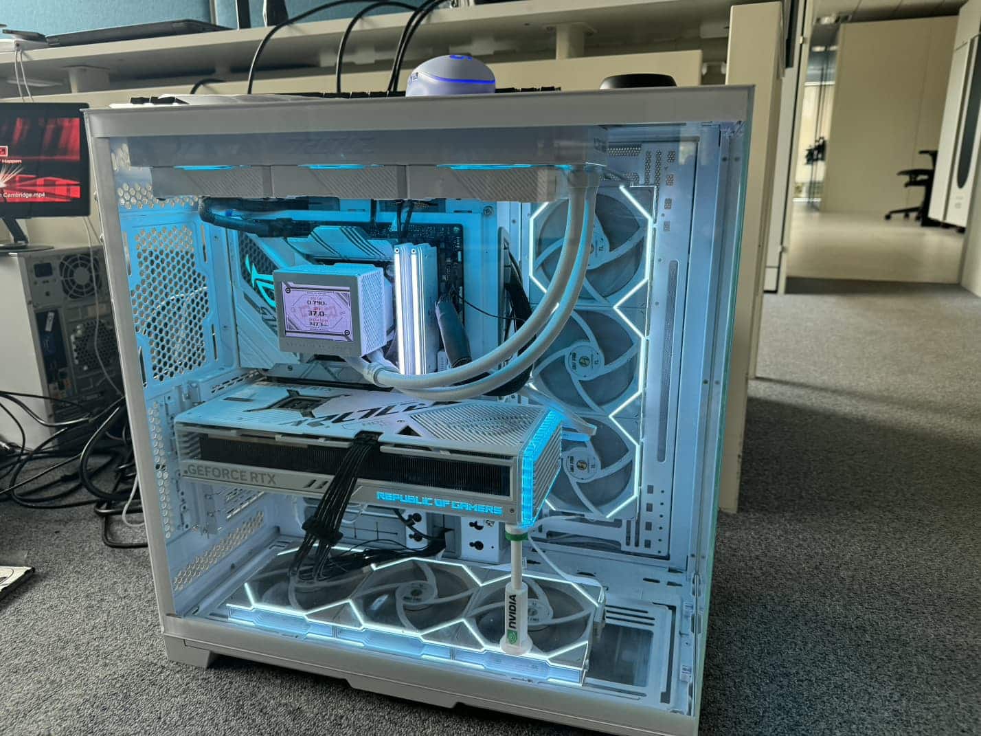 White custom PC with liquid cooling and glass panels