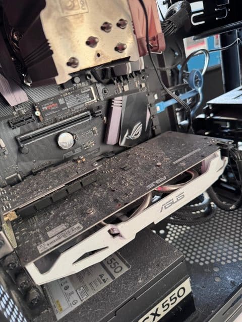 Desktop PC with a dusty CPU cooler and a white graphics card