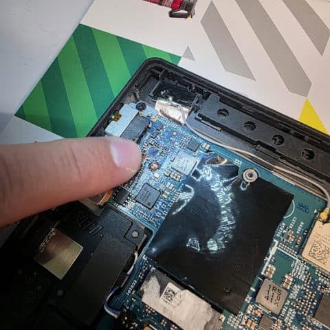 Checking the power delivery chip area on a laptop motherboard