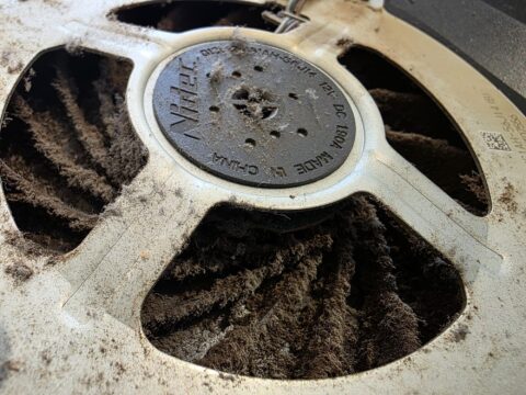 PS5 console fan blades caked in a thick layer of dust