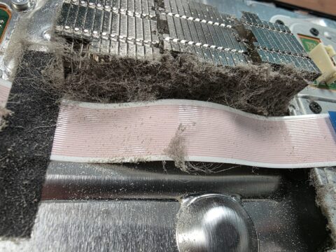 PS5 heatsink with a dense layer of dust blocking the air path