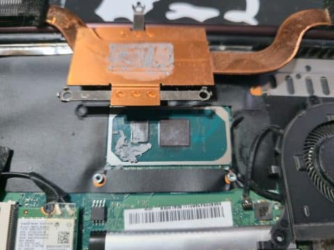 Laptop processor and copper heat plate with dried-out, cracked thermal paste