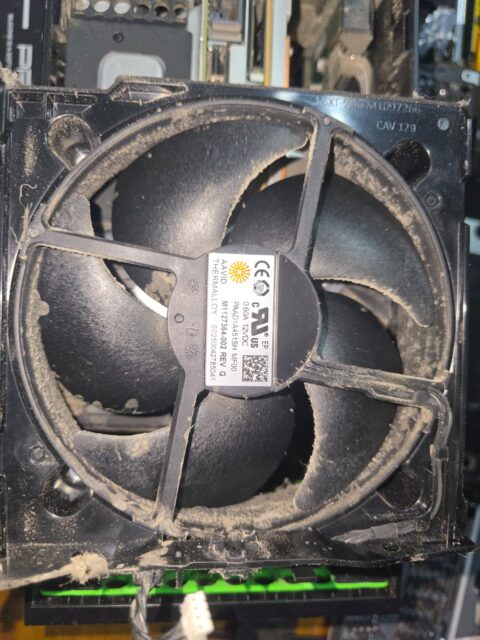 Xbox fan with a layer of dust on the blades and housing