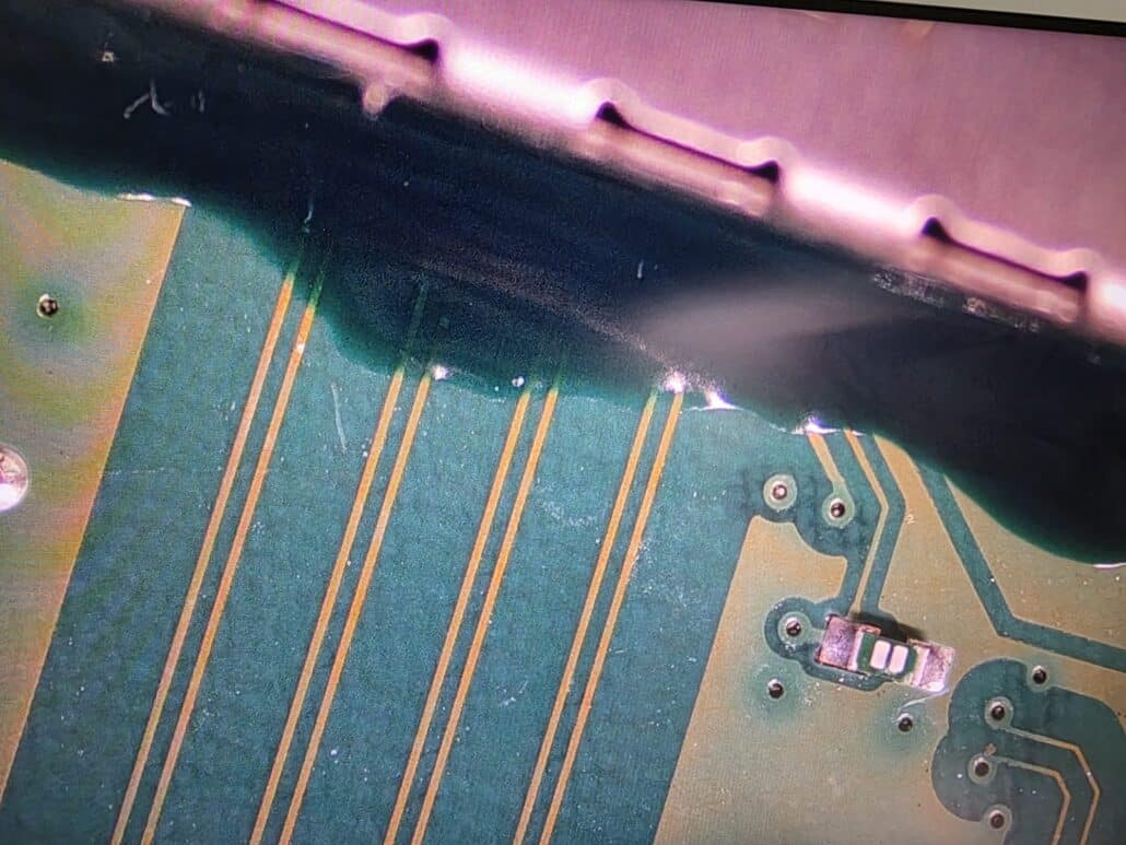 The HDMI track area of the Xbox Series X motherboard under the microscope during the rebuild