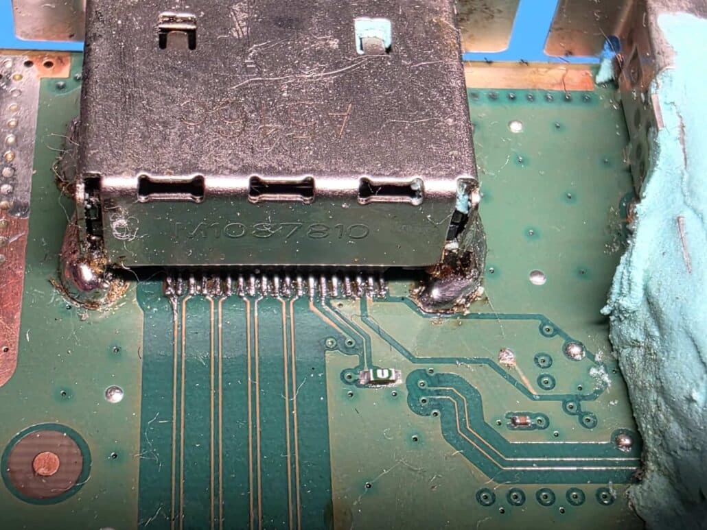 New HDMI port micro-soldered onto the rebuilt pads of the Xbox Series X motherboard